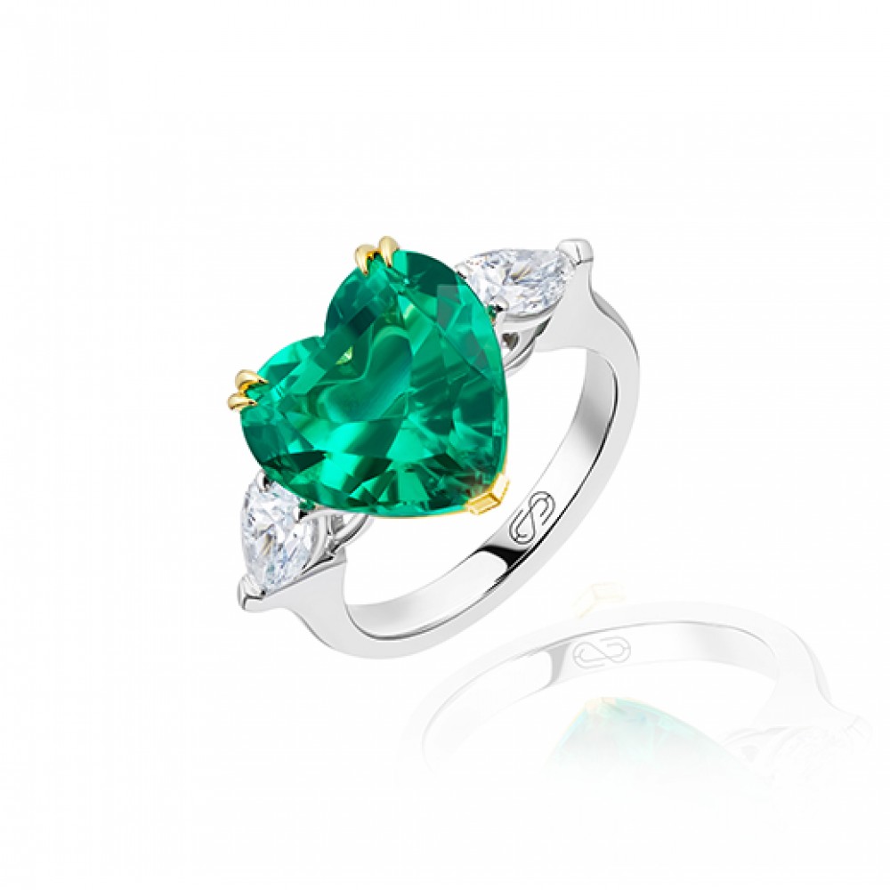 Ring, 18-carat white gold with diamonds and emeralds